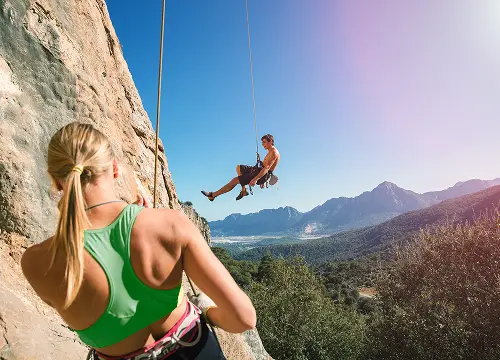 Clinical organization climbers leading on mountain